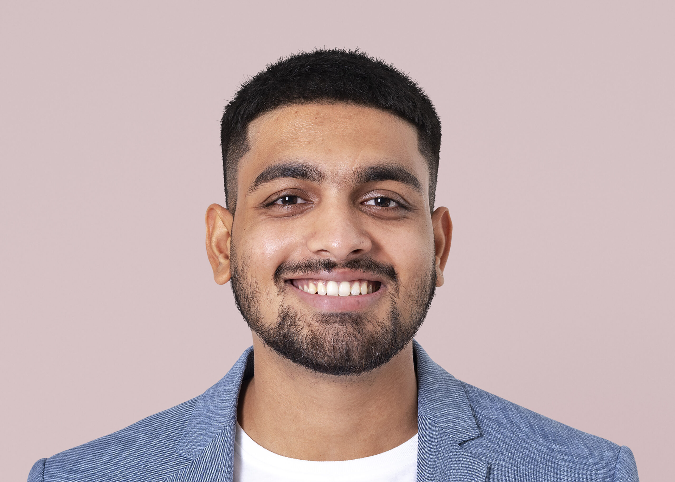 smiling businessman face portrait, wearing suit